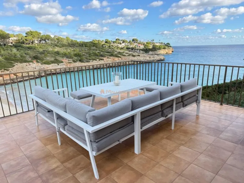 Apartment on the front line to the sea in Cala Mandia — photo 1