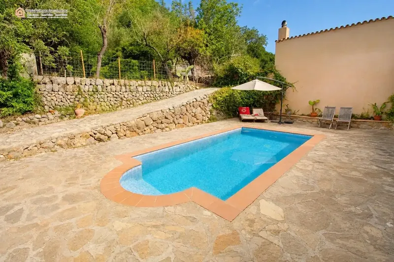 In a privileged natural setting in Bunyola, surrounded by Mediterranean vegetation and mountains, we present this unique single-family home — photo 9