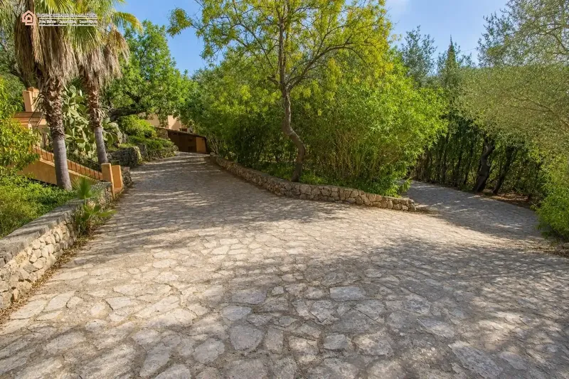 In a privileged natural setting in Bunyola, surrounded by Mediterranean vegetation and mountains, we present this unique single-family home — photo 3