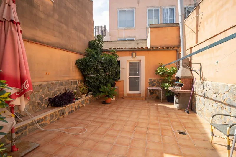House with a large patio, several terraces and garage — photo 1