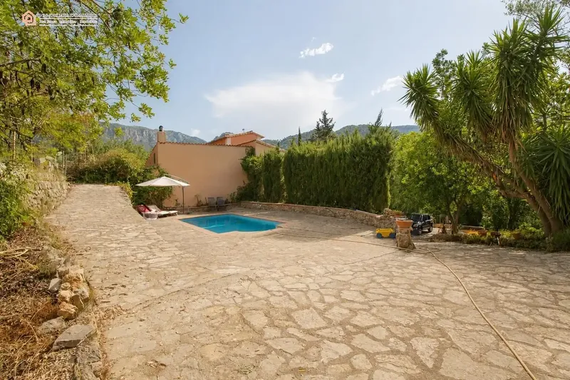 In a privileged natural setting in Bunyola, surrounded by Mediterranean vegetation and mountains, we present this unique single-family home — photo 7