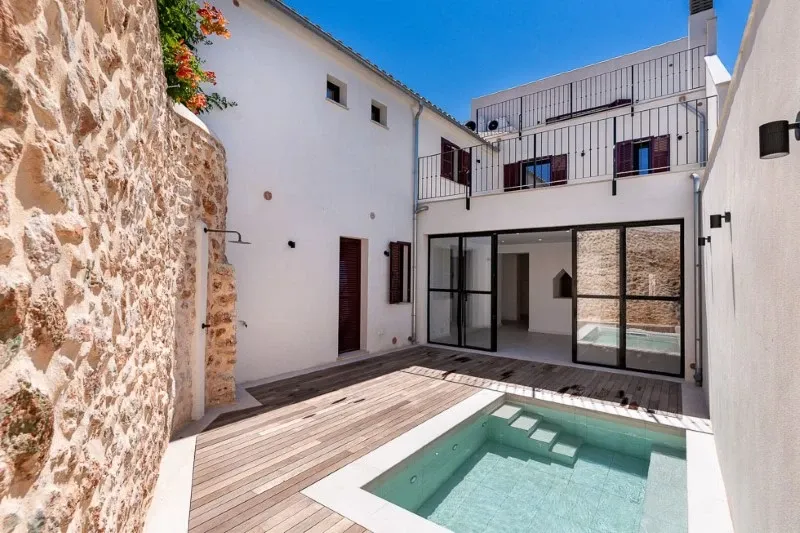Renovated village house in Campos with modern interior design, pool and several terraces — photo 1