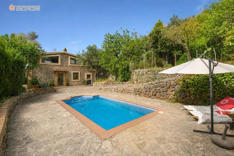 In a privileged natural setting in Bunyola, surrounded by Mediterranean vegetation and mountains, we present this unique single-family home — photo 8