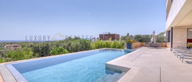 Contemporary villa in Sa Cabaneta with panoramic sea and mountain views — photo 1