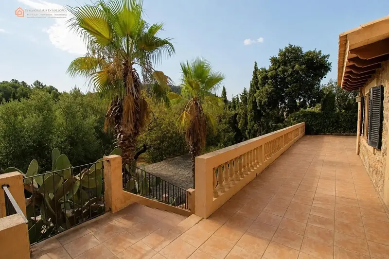 In a privileged natural setting in Bunyola, surrounded by Mediterranean vegetation and mountains, we present this unique single-family home — photo 11