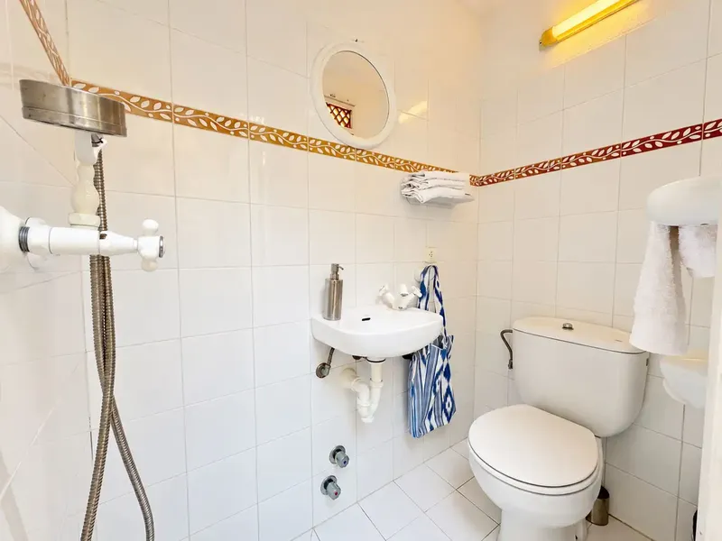 Distributed over 3 floors with great charm, this renovated 144 m2 house in Pollensa has a patio and terraces of approx. 44 m2, 3 ha — photo 12