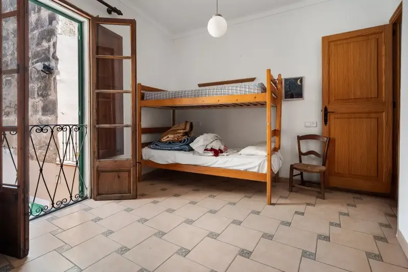 Situated in the heart of the charming old town of Alcudia, this typical Mallorcan house offers 400 m² of living space distributed — photo 9