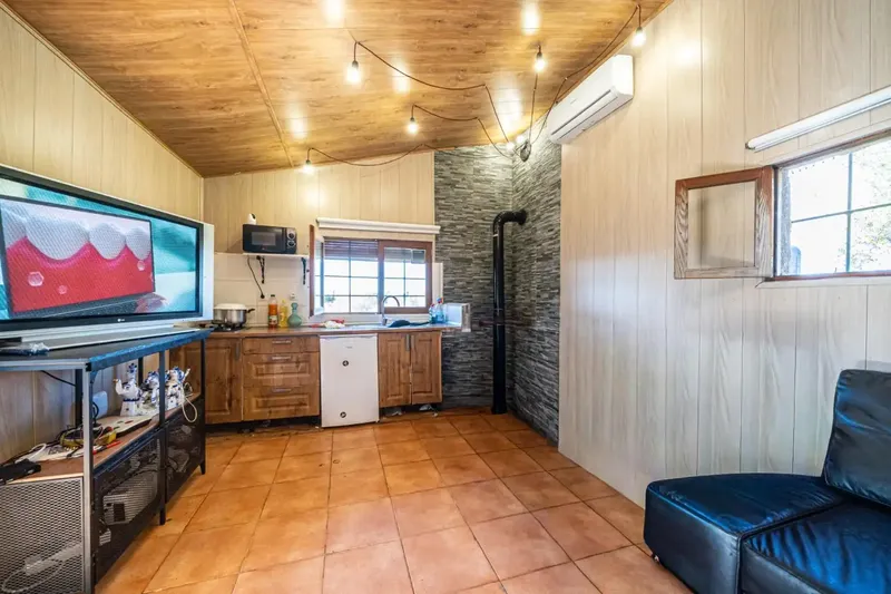 We present this rustic estate in the town of Llucmajor. The land has an area of 24,416 square meters with several buildings — photo 4