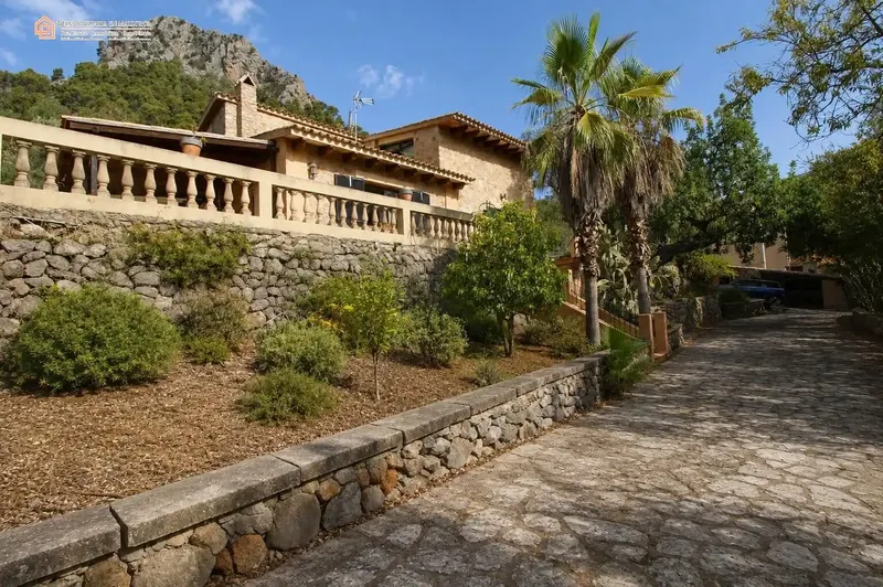 In a privileged natural setting in Bunyola, surrounded by Mediterranean vegetation and mountains, we present this unique single-family home — photo 2