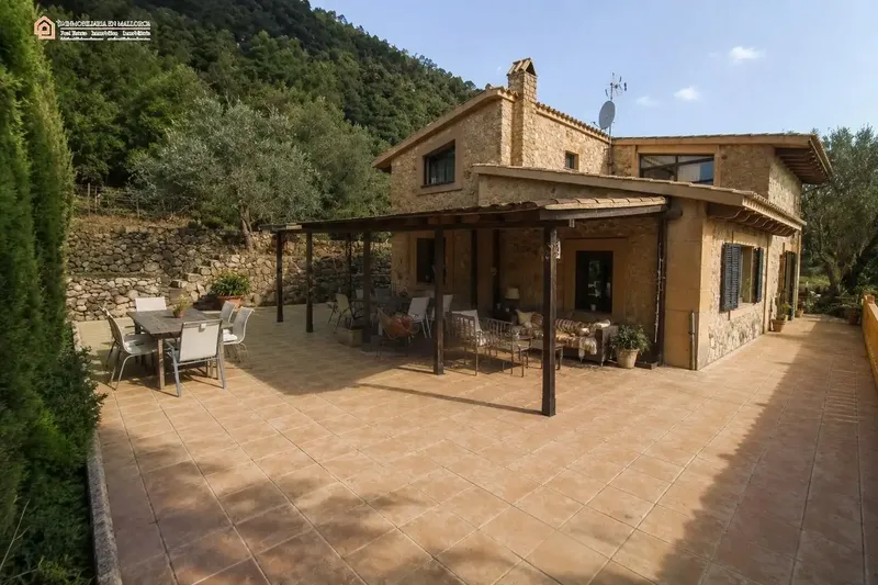 In a privileged natural setting in Bunyola, surrounded by Mediterranean vegetation and mountains, we present this unique single-family home — photo 12