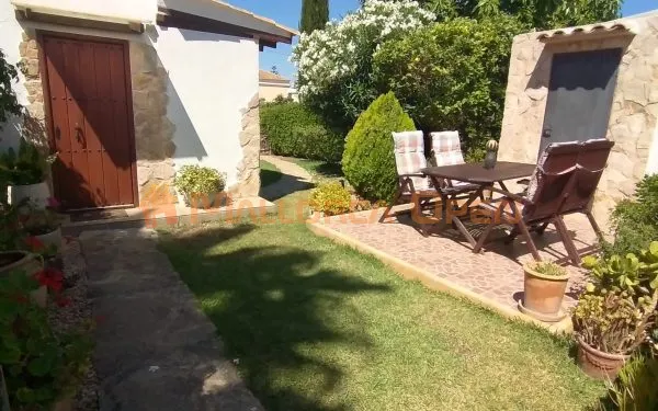 Ground floor with private garden and communal pool in Cala Mandia — photo 1