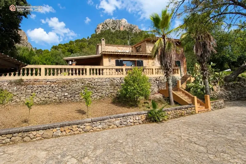 In a privileged natural setting in Bunyola, surrounded by Mediterranean vegetation and mountains, we present this unique single-family home — photo 1