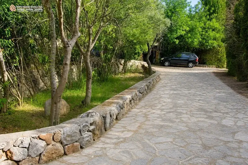 In a privileged natural setting in Bunyola, surrounded by Mediterranean vegetation and mountains, we present this unique single-family home — photo 4