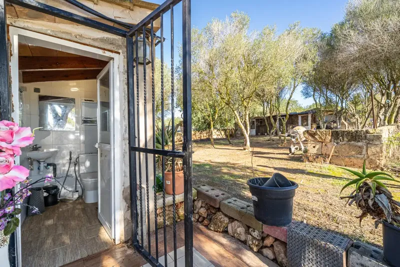 We present this rustic estate in the town of Llucmajor. The land has an area of 24,416 square meters with several buildings — photo 10