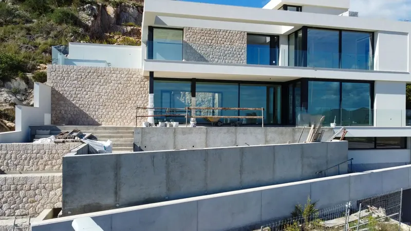 For sale this modern chalet under construction, near completion, of a unique style, with impressive sea and mountain views — photo 10