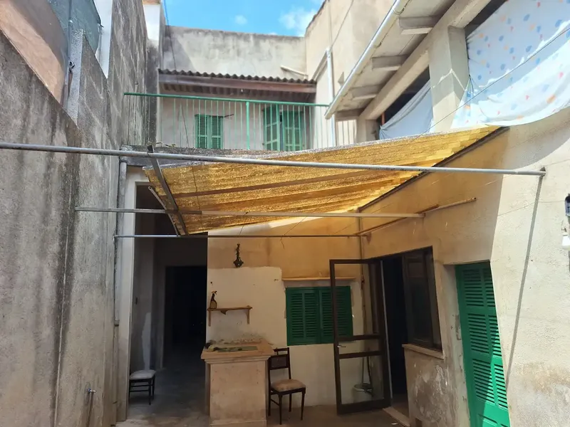 Discover this charming village house in the heart of Petra, built in 1900 and full of history. With a built area of 16 — photo 4
