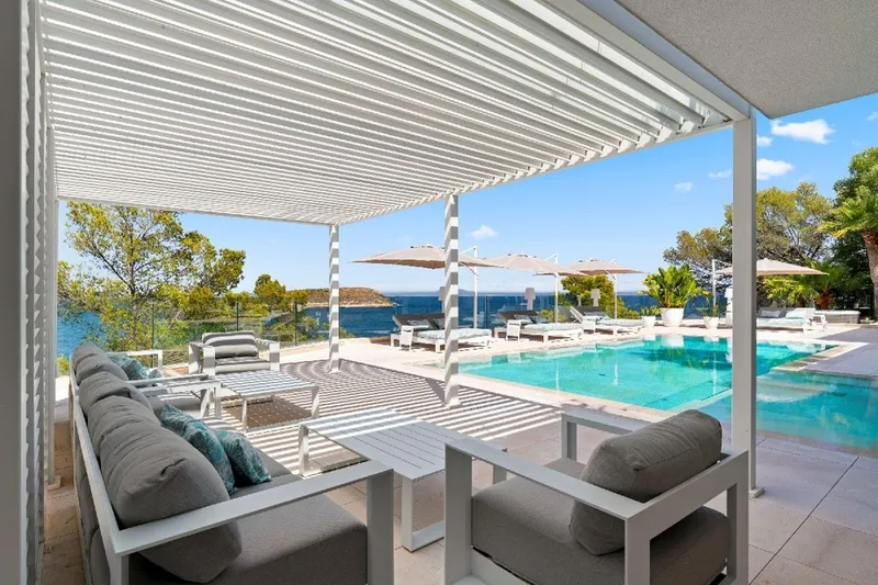 Exquisitely renovated frontline designer villa in Cala Vinyas—private beach access, pool, spa, and elevator — photo 1