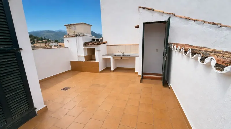 This house in Pollença has 112 m2 of living space plus a 40 m2 vaulted cellar and a rooftop terrace of approx. 20 m — photo 1