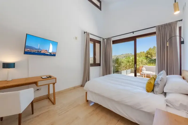 This spacious detached villa for sale in Canyamel is beautifully presented in a chic contemporary style with high ceilings — photo 9