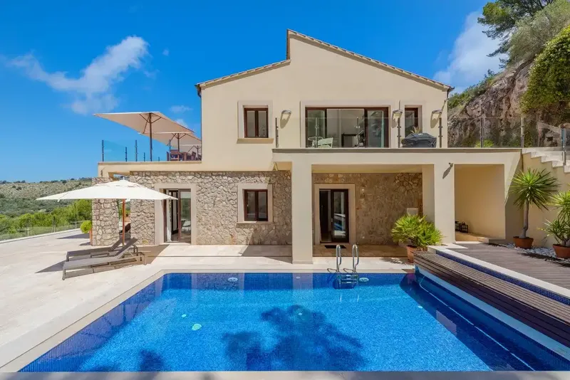 This spacious detached villa for sale in Canyamel is beautifully presented in a chic contemporary style with high ceilings — photo 1